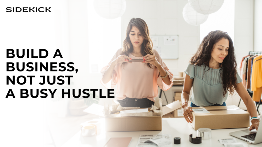 Two women packing products and working on a laptop with text: “Build a business, not just a busy hustle